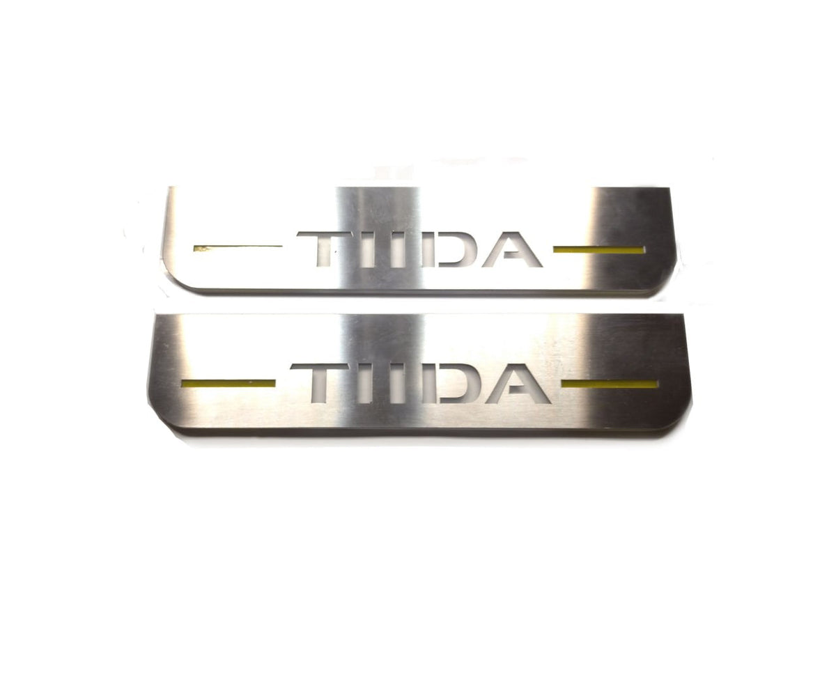 Nissan Tiida 2004+ entry guards in stainless steel with TIIDA logo