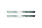 Two long silver-finished door sill plates with Tiggo lettering on a light background, straight-on view.
