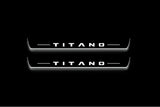 Two long door sill plates with Titano lettering and edges illuminated in white, straight-on view on a dark background.