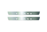 Two long silver-finished door sill plates with Titano lettering on a light background, straight-on view.