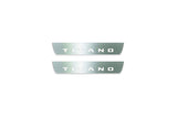 Two short silver-finished door sill plates with Titano lettering on a light background, straight-on view.