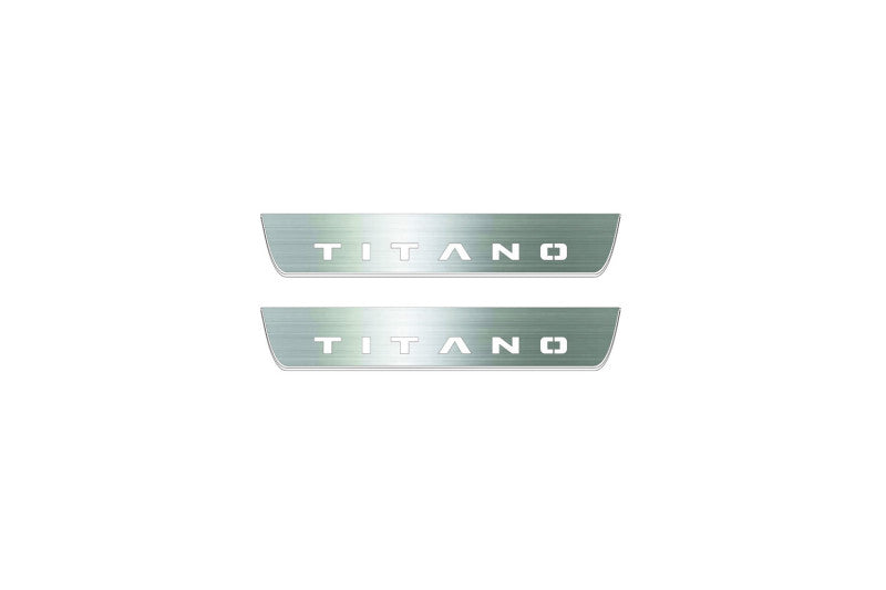 Two short silver-finished door sill plates with Titano lettering on a light background, straight-on view.