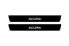 Catalog illustration of two black front door sill plates with Acura lettering.