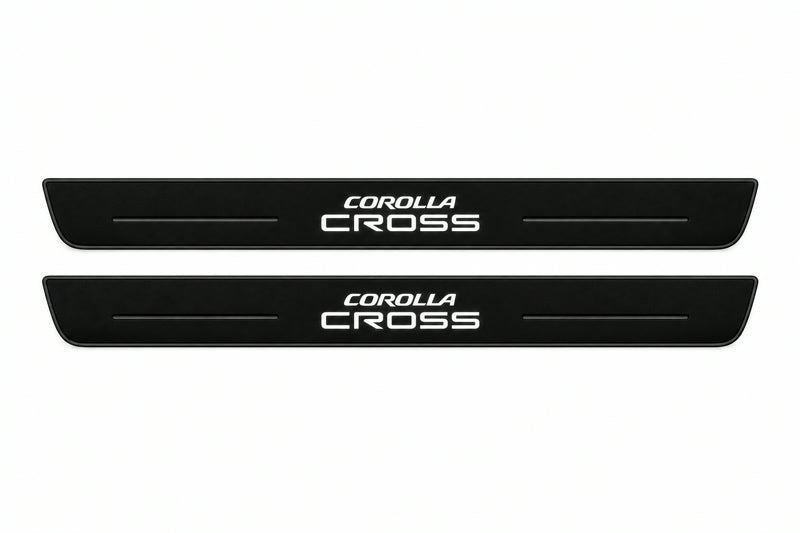Catalogue illustration of two front black Matte PRO LED door sill plates with illuminated Corolla Cross lettering for Toyota Corolla Cross XG10; dimensions are selected during manufacture.