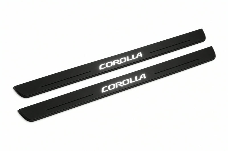 Catalogue illustration of two front black Matte PRO LED door sill plates with illuminated Corolla lettering for Toyota Corolla XI E160; dimensions are selected during manufacture.