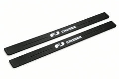 Catalogue illustration of two front black Matte PRO LED door sill plates with illuminated FJ Cruiser lettering for Toyota FJ Cruiser XJ10; dimensions are selected during manufacture.