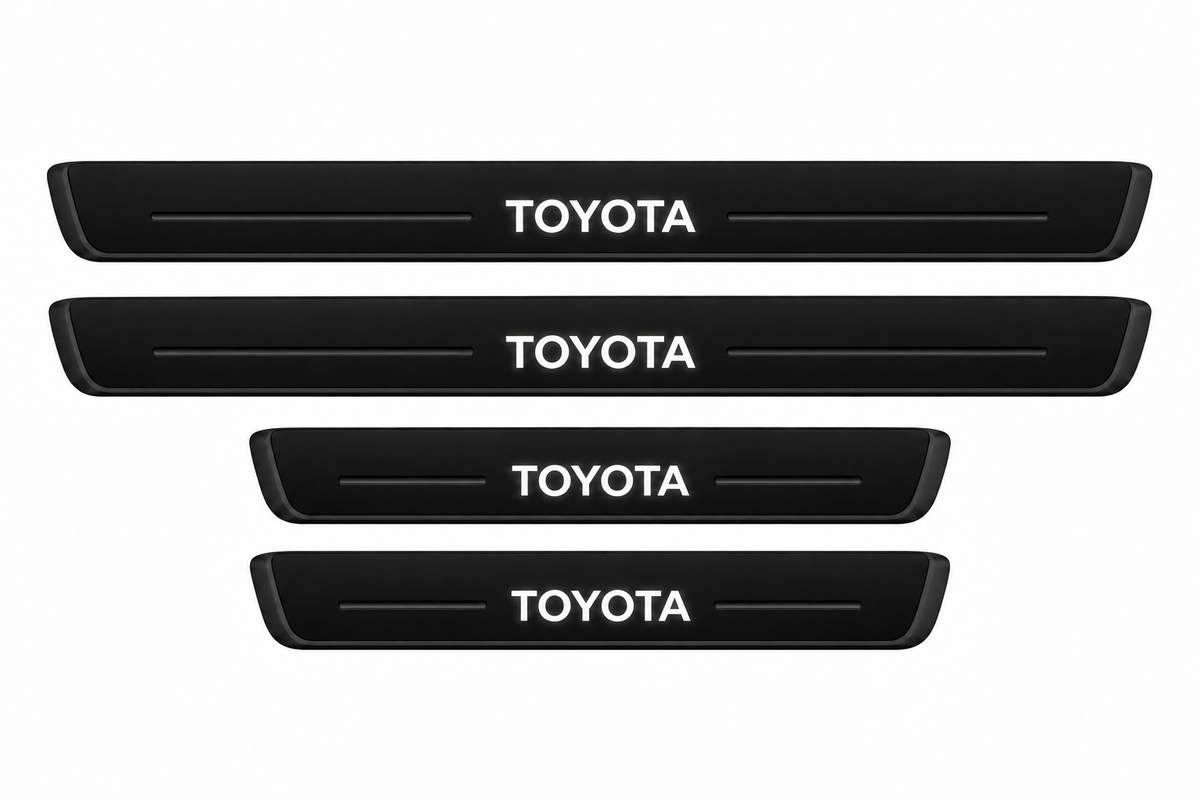 Catalogue illustration of two long front and two short rear black Matte PRO sill plates with illuminated TOYOTA lettering only on top, unlit horizontal grooves and opaque side edges. Actual dimensions selected for Land Cruiser 250 J250 during manufacture.