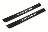 Catalogue illustration of two front black Matte PRO LED door sill plates with illuminated Tacoma lettering for Toyota Tacoma N400; dimensions are selected during manufacture.