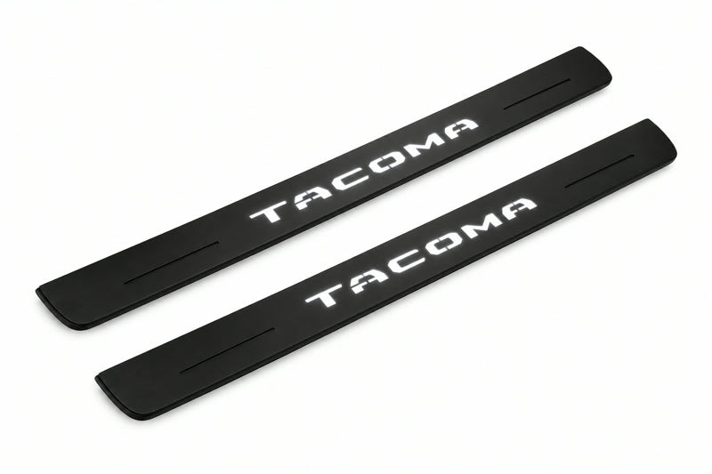 Catalogue illustration of two front black Matte PRO LED door sill plates with illuminated Tacoma lettering for Toyota Tacoma N400; dimensions are selected during manufacture.