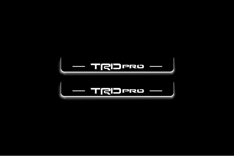 Toyota Tacoma IV 2024+ illuminated entry guards in stainless steel with TRD pro logo