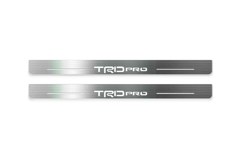 Toyota Tacoma IV 2024+ door sill plates in stainless steel with TRD pro logo
