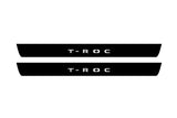 Volkswagen T-Roc 2017+ illuminated entry guards in matte black coated stainless steel with T-Roc logo