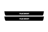 Hyundai Tucson I 2004+ illuminated entry guards in stainless steel with Tucson logo