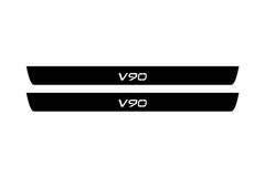 Catalog illustration of two black front door sill plates with V90 lettering.