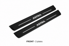 Matte PRO catalogue illustration showing two FRONT plates with illuminated Astra lettering on a white background; Vauxhall Astra VII (Astra K) dimensions are selected during manufacture; rear plates are not pictured.