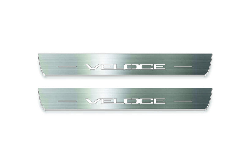 Two long silver-finished door sill plates with Veloce lettering on a light background, straight-on view.