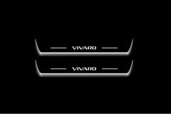 Two long door sill plates with Vivaro lettering and edges illuminated in white, straight-on view on a dark background.
