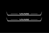 Two long door sill plates with Vivaro lettering and edges illuminated in white, straight-on view on a dark background.