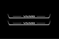 Two long door sill plates with Vivaro lettering and edges illuminated in white, straight-on view on a dark background.