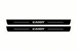 Catalogue illustration of two front black Matte PRO LED door sill plates with illuminated Caddy lettering for Volkswagen Caddy Van SB; dimensions are selected during manufacture.