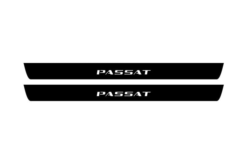 Catalog illustration of two black front door sill plates with Passat lettering.