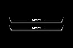 Two long door sill plates with VRS lettering and edges illuminated in white, straight-on view on a dark background.