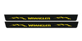 Catalog illustration of two long black door sill plates with yellow Wrangler lettering and mountain graphics.