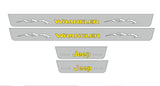 Catalog illustration of four gray door sill plates: yellow Wrangler lettering with mountain graphics on the long pair and Jeep lettering on the short pair.