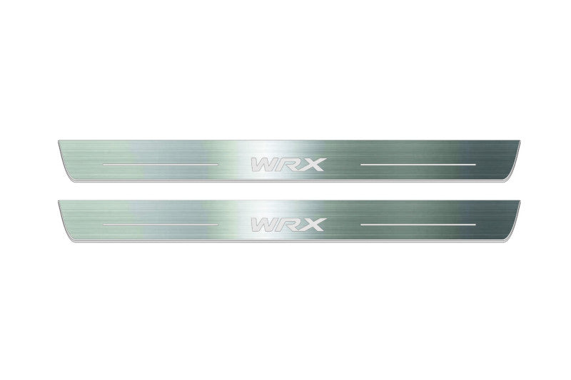 Two long silver-finished door sill plates with WRX lettering on a light background, straight-on view.