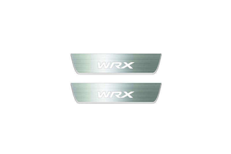 Two short silver-finished door sill plates with WRX lettering on a light background, straight-on view.