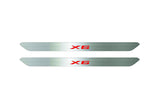 Catalog illustration of two narrow silver door sill inserts with red X6 lettering on a white background.