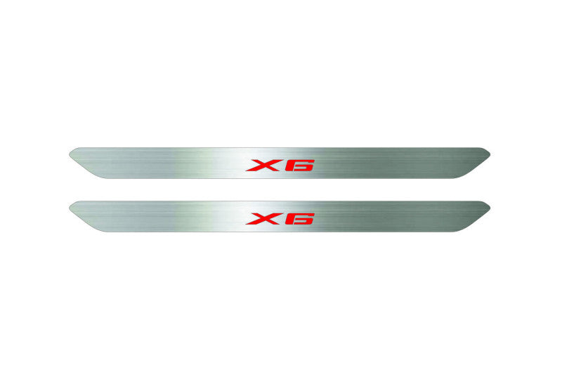 Catalog illustration of two narrow silver door sill inserts with red X6 lettering on a white background.