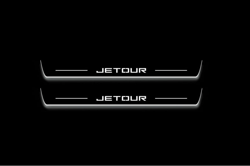 Two long door sill plates with Jetour lettering and edges illuminated in white, straight-on view on a dark background.