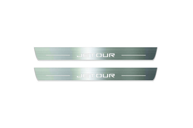 Two long silver-finished door sill plates with Jetour lettering on a light background, straight-on view.