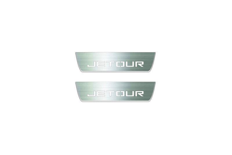 Two short silver-finished door sill plates with Jetour lettering on a light background, straight-on view.