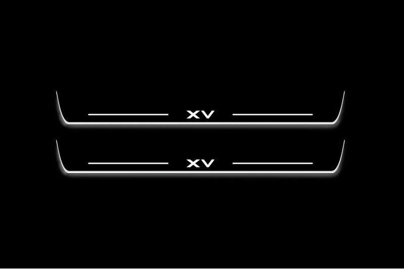 Two long door sill plates with XV lettering and edges illuminated in white, straight-on view on a dark background.