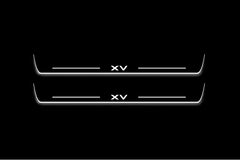 Two long door sill plates with XV lettering and edges illuminated in white, straight-on view on a dark background.
