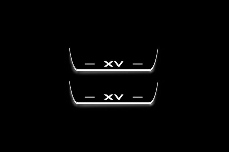 Two short door sill plates with XV lettering and edges illuminated in white, straight-on view on a dark background.