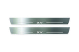 Two long silver-finished door sill plates with XV lettering on a light background, straight-on view.