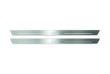 Two long silver-finished door sill plates with Yaris lettering on a light background, straight-on view.