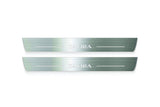Two long silver-finished door sill plates with Zafira lettering on a light background, straight-on view.