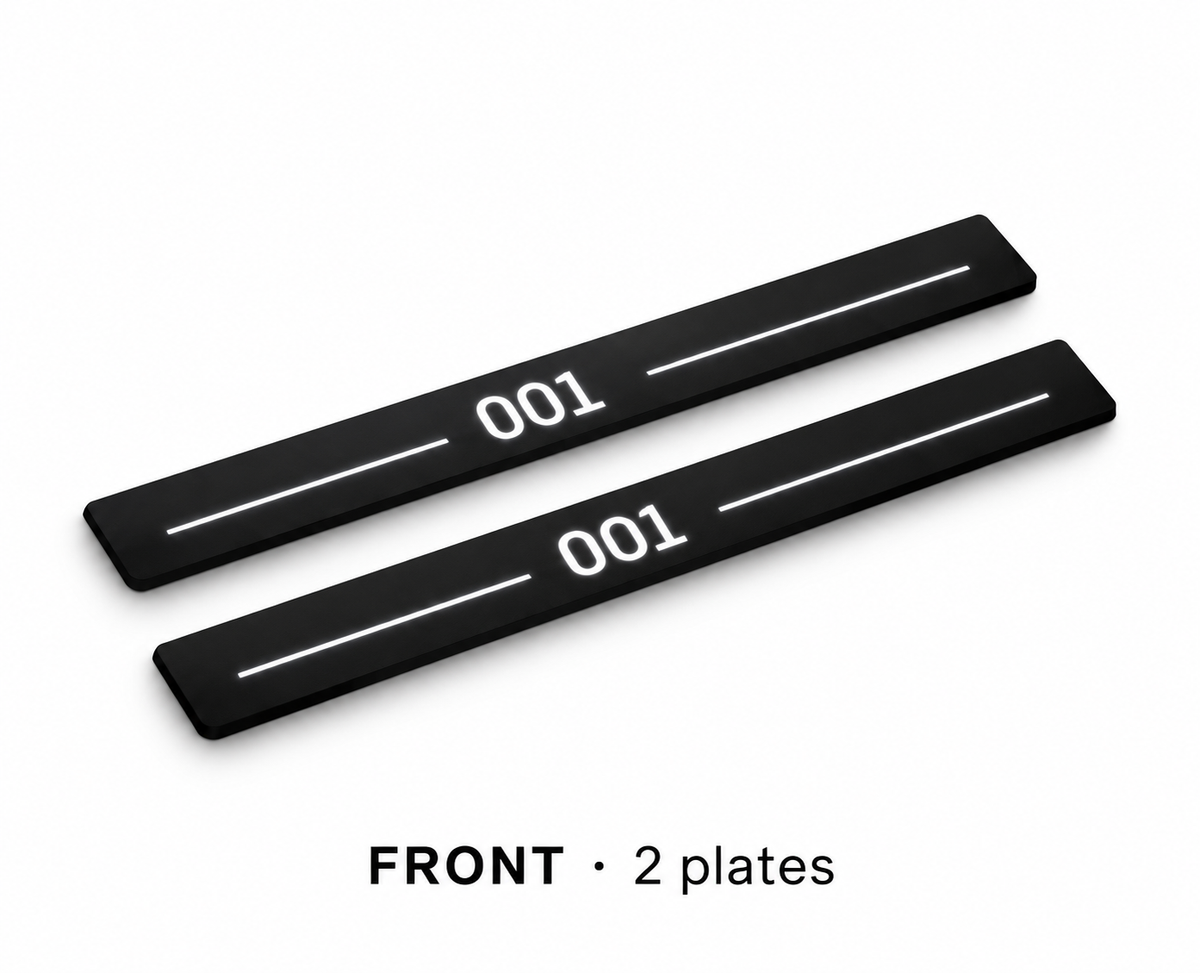 Matte PRO catalogue illustration: two flat black FRONT plates with illuminated 001 lettering and top lines on white; not exact vehicle dimensions