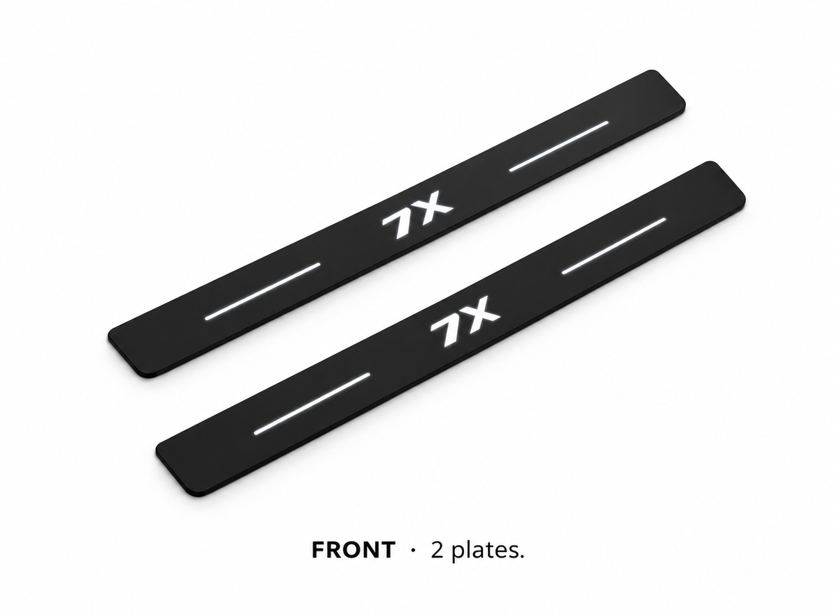 Matte PRO catalogue illustration: two flat black FRONT plates with illuminated 7X lettering and top lines on white; not exact vehicle dimensions
