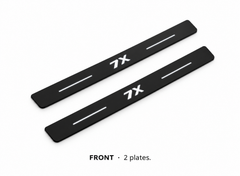 Matte PRO catalogue illustration: two flat black FRONT plates with illuminated 7X lettering and top lines on white; not exact vehicle dimensions