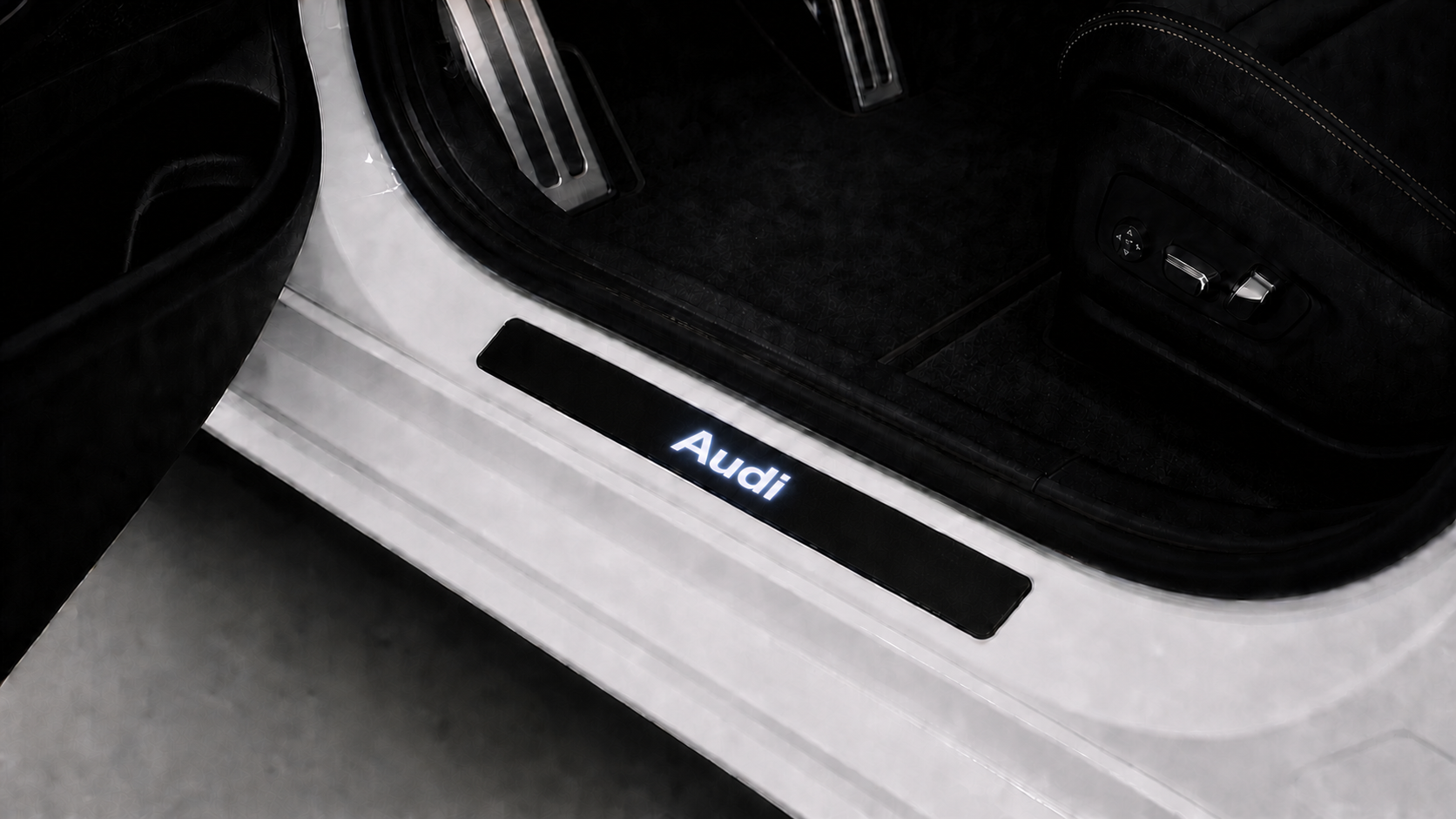 Matched installed Audi LED door sill scene with Audi illuminated inscription